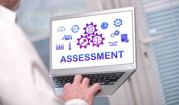 Assessment concept shown on a laptop used by a man - Foto, afbeelding