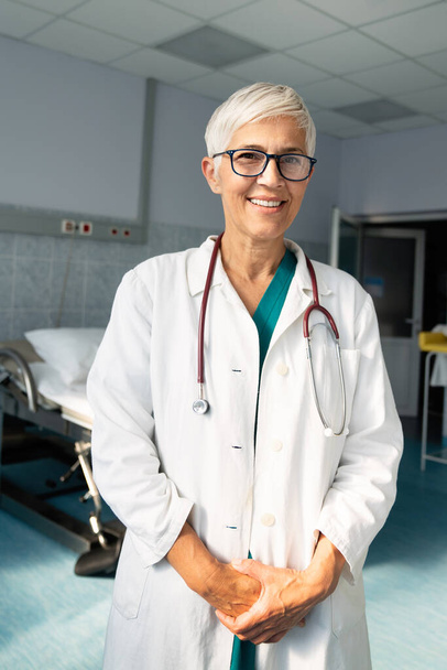 Portrait of successful female doctor in hospital. Healthcare, medicine, people concept - Фото, зображення