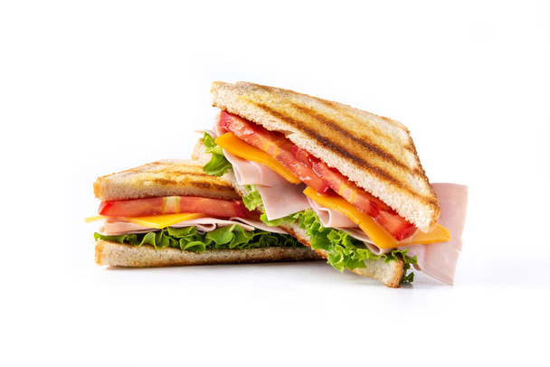 Sandwich mit Tomaten, Salat, Schinken und Käse isoliert auf weißem Hintergrund. - Foto, Bild