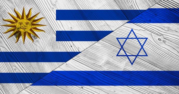 Vlaggen van Uruguay en Israël op houten planken - Foto, afbeelding