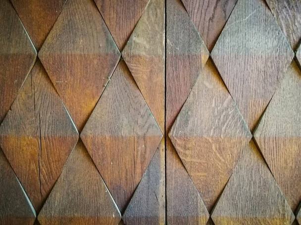 Details of wooden door decorated with diamond-shaped high relief - Photo, Image