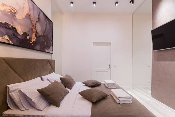 nterior photography, modern bedroom, with large stylish bed, modern design, in beige - Fotó, kép