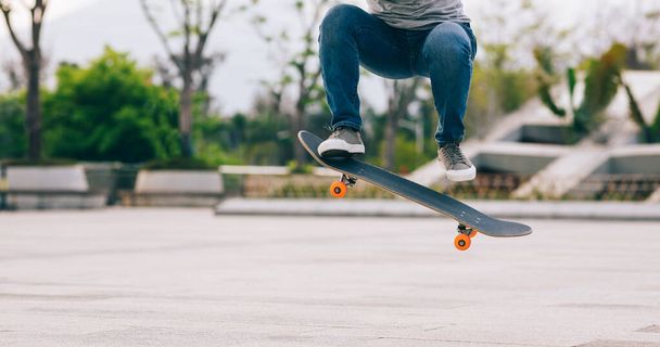 Skateboarder legs skateboarding at outdoors - Fotoğraf, Görsel