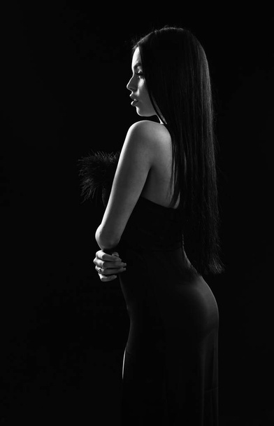 Mysterious fashion model. Sexy girl in darkness. Nude shoulders. Girl with long hair. Impeccable appearance. Mysterious fashion lady. Attractive woman. Aesthetics female beauty. Mystery concept - Foto, Imagem