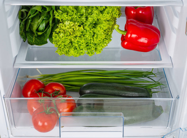 Open fridge full of fresh fruits and vegetables, healthy food background, organic nutrition, health care, dieting concept - Foto, afbeelding