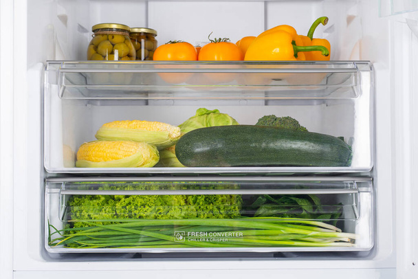 Open fridge full of fresh fruits and vegetables, healthy food background, organic nutrition, health care, dieting concept - Photo, Image