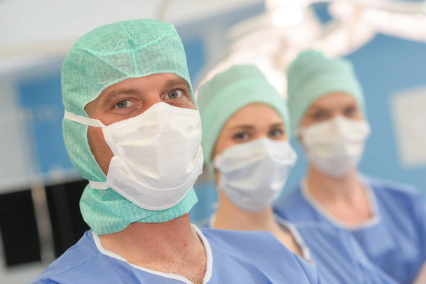 portrait of surgeons standing in operation room at the hospital - Photo, image