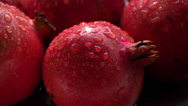 Fresh Pomegranates rich in natural antioxidants. Concept of red fruits, vitamins and natural antioxidants to the skin for beauty. - Photo, Image