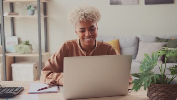Smiling young interracial business woman work distant on laptop - Imágenes, Vídeo