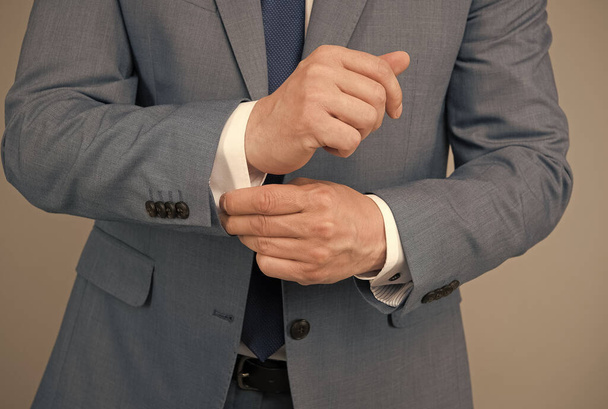 Hands adjusting sleeves formal suit business outfit, perfectionism concept - Foto, afbeelding