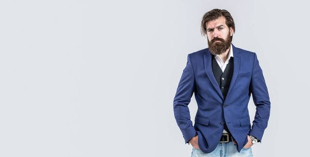 Handsome bearded businessman in classic suits. Hand in with wrist watch in a business suit. Elegant handsome man in suit. Man in suit. Male beard and mustache. Sexy male, brutal macho, hipster - Photo, image