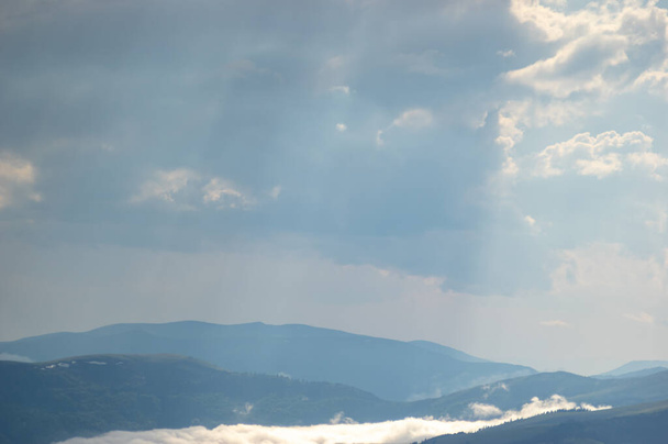 Fog on a mountain range in the Carpathian mountains. Beautiful landscape - Фото, зображення
