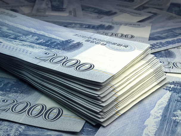 Money of North Korea. North Korean won bills. KPW banknotes. 2000 won. Business, finance, news background. - Photo, Image