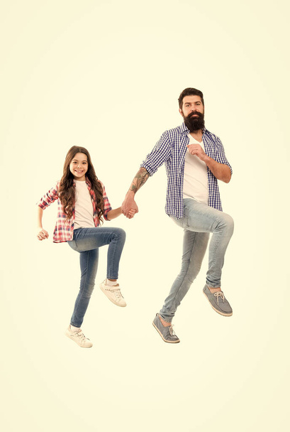 Love more worry less. Happy father and daughter walk holding hands. Bearded man and little child enjoy studio photo shoot. Family love. Love and trust. Do what you love - Photo, Image