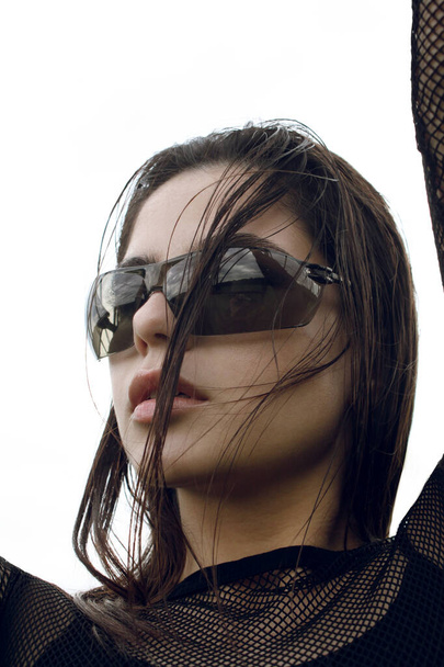portrait of a brunett woman with trendy summer glasses - Foto, Imagem