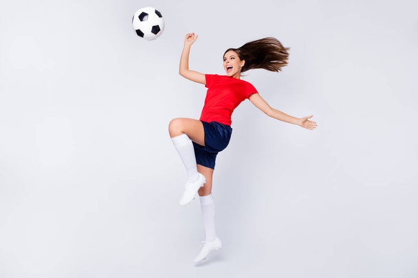 Full body profile photo of crazy air fly joy player soccer team grand final league game jump up passing ball wear spain uniform t-shirt shorts cleats knee socks isolated white color background - Photo, Image