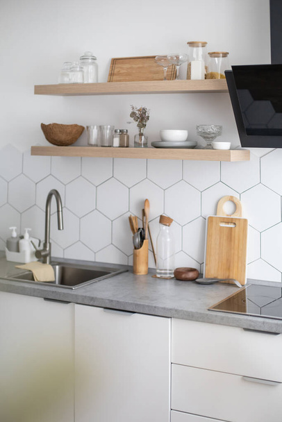 Empty modern kitchen interior white cosiness apartment cuisine design domestic furniture equipment - Фото, изображение