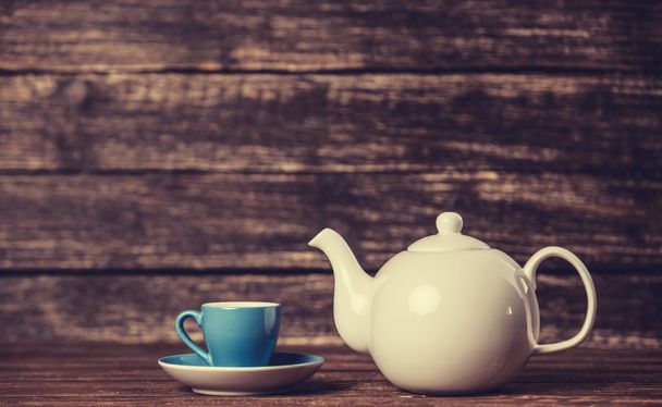Teapot and cup of tea - Foto, afbeelding
