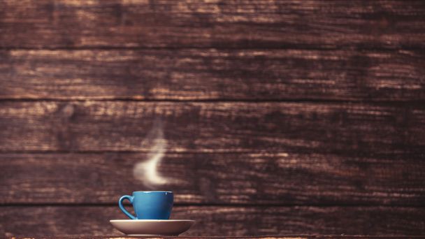 Tee- oder Kaffeetasse auf Holztisch. - Foto, Bild
