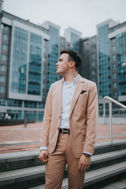 A caucasian young businessman in suit standing outdoor - Φωτογραφία, εικόνα