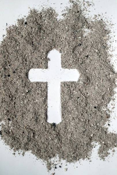 Cross made of ashes. Ash Wednesday. Lent season. France.  - Foto, afbeelding