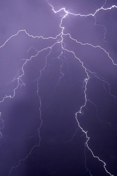 many lightning strikes on night sky background, outdoors - Photo, Image