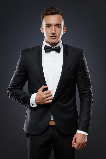 business man in suit on a dark background - Фото, зображення