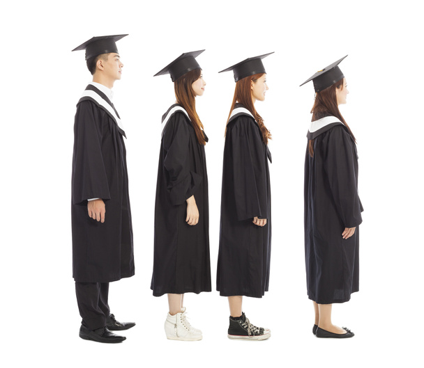 estudiantes graduados de pie una row.isolated en blanco
 - Foto, imagen