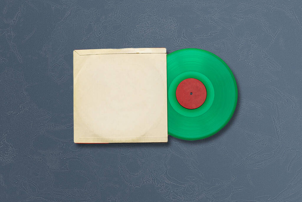 a the mockup template with the new vinyl disc on color surface, music album cover design - Photo, image