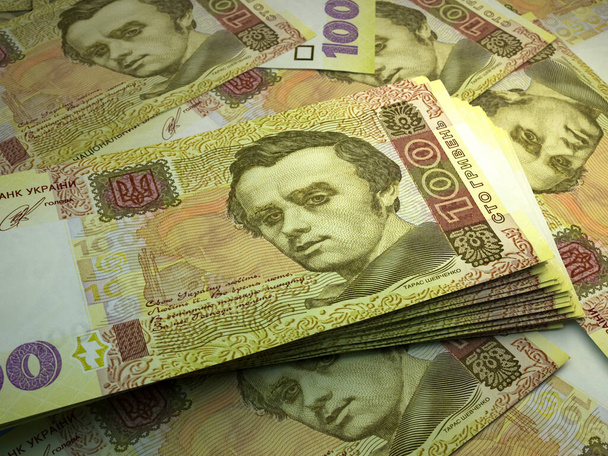 Ukrajna pénze. Ukrán hrivnya számlák. UAH bankjegyek. 100 hrivni. Üzleti, pénzügyi, hírek háttere. - Fotó, kép