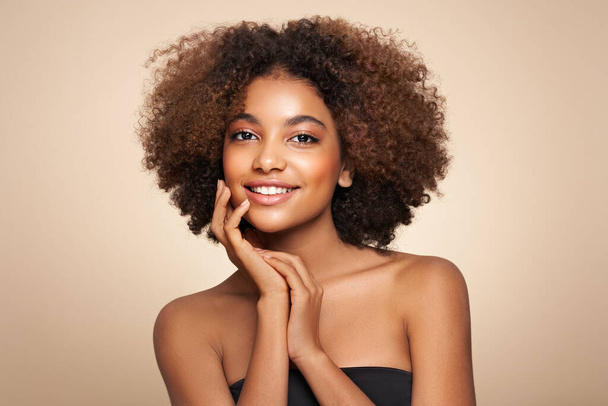 Beauty portrait of African American girl with afro hair. Beautiful black woman. Cosmetics, makeup and fashion - Фото, изображение