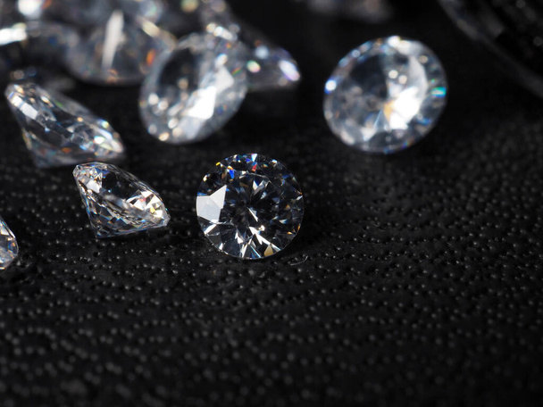 Close up shoot of shiny diamonds. Shoot on a black textured background - Foto, Imagen