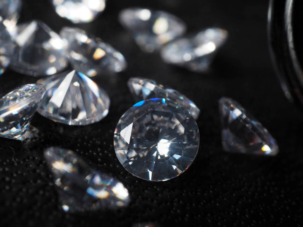 Close up shoot of shiny diamonds. Shoot on a black textured background - 写真・画像