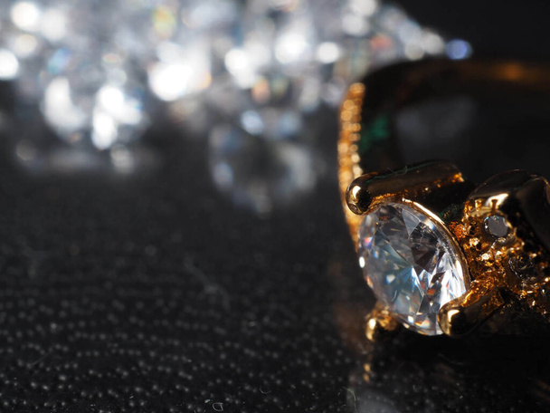 Close up shoot of shiny diamonds. Shoot on a black textured background - Photo, Image