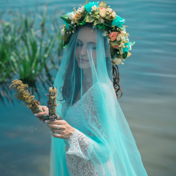 Bride nymph at water, Slavic rituals, pagan magic scene, nature power concept - Foto, imagen