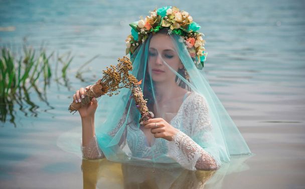 Bride nymph at water, Slavic rituals, pagan magic scene, nature power concept - Photo, image