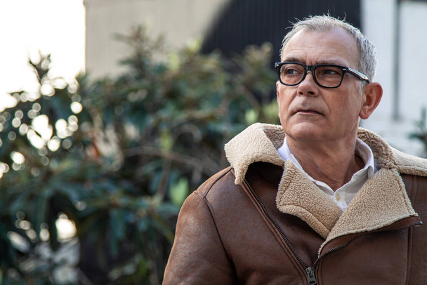 portrait of attractive adult man in coat and glasses - Foto, Imagen