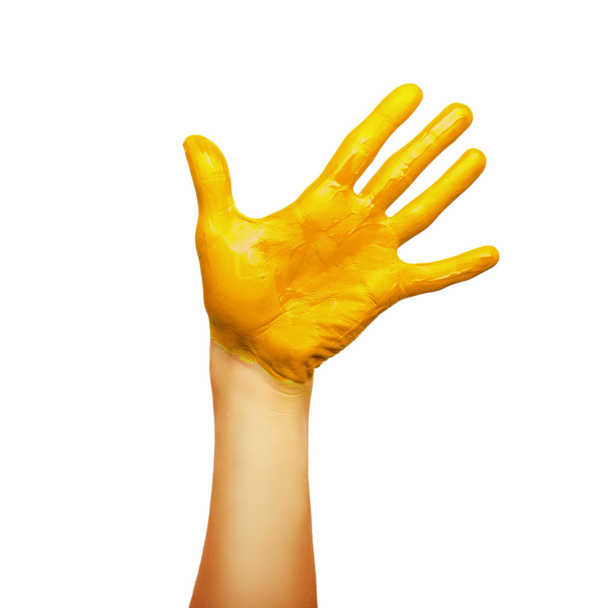 hand in yellow paint - Foto, imagen
