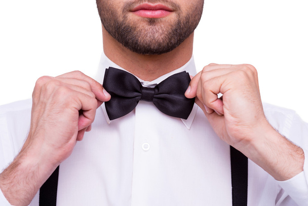 Man adjusting bow tie. - Foto, Imagem