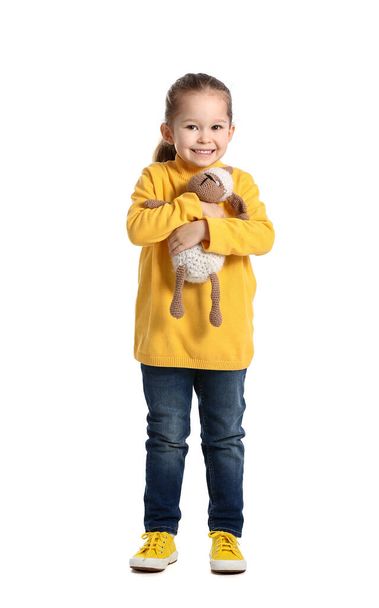 Cute little girl with toy on white background - Photo, image