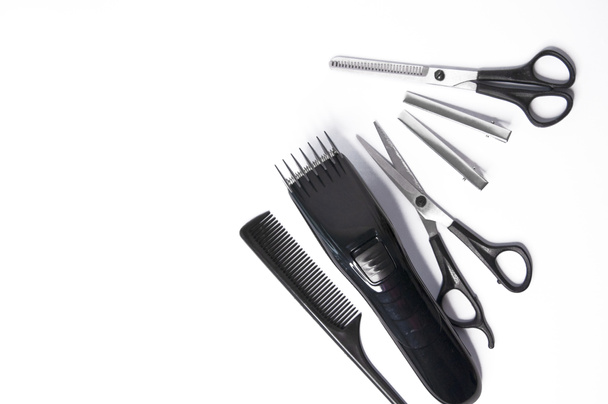 Hairdresser items scissors, comb, clipper on a white background - 写真・画像