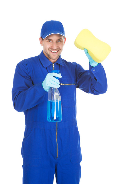 Servant Holding Cleaning Spray And Sponge - Valokuva, kuva
