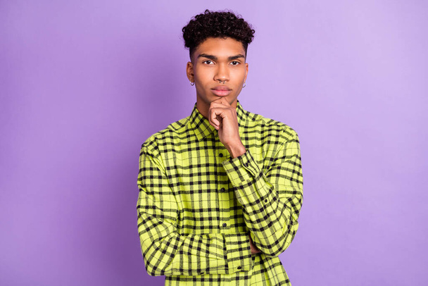 Portrait of attractive focused guy wear checked shirt making decision isolated over violet purple color background - Фото, зображення