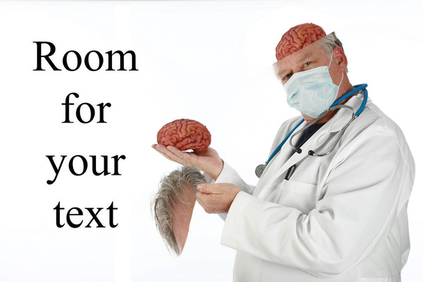 brain surgeon. medical and science.  a doctor or brain surgeon holds a brain with a strange confused look on his face. isolated on white. room for your text. human brain isolated on white. A brain surgeon replaces his old brain with a new one.  - Photo, Image