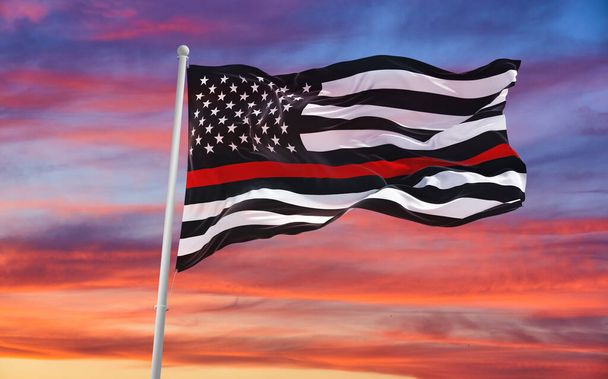 Thin Red Line. Black Flag of USA with Firefighter red Line waving in the wind on flagpole against the sky with clouds on sunny day. 3d illustraion. - Foto, Imagem