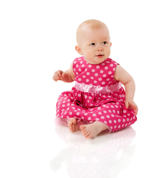 Six month girl sitting on floor isolated on white - Foto, afbeelding