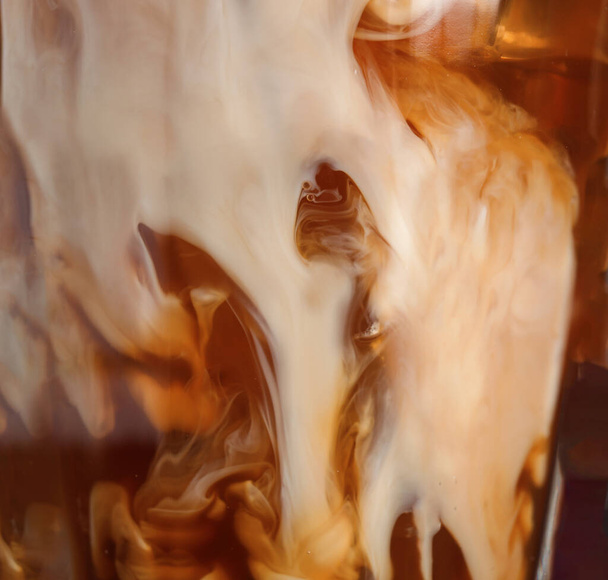 Glass with cold coffee and milk, closeup - Foto, afbeelding