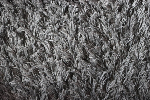 tappeto grigio protegge il calore dà calore capelli lunghi - Foto, immagini