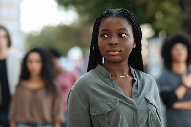 Portrait of young african american woman leading strikers - Foto, afbeelding