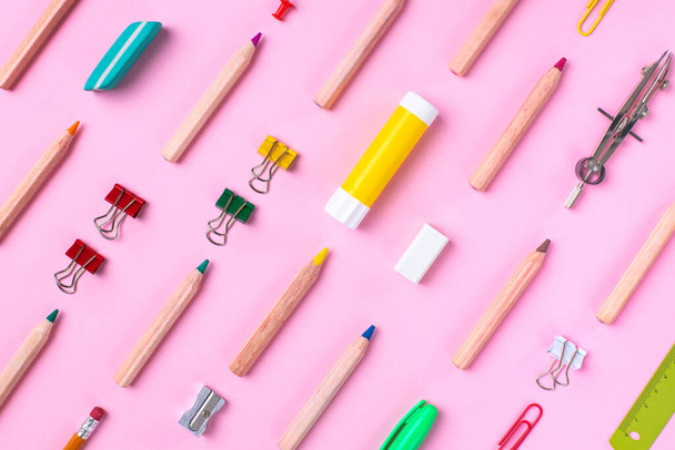 School stationery items on pink background. Back to school concept - Foto, afbeelding